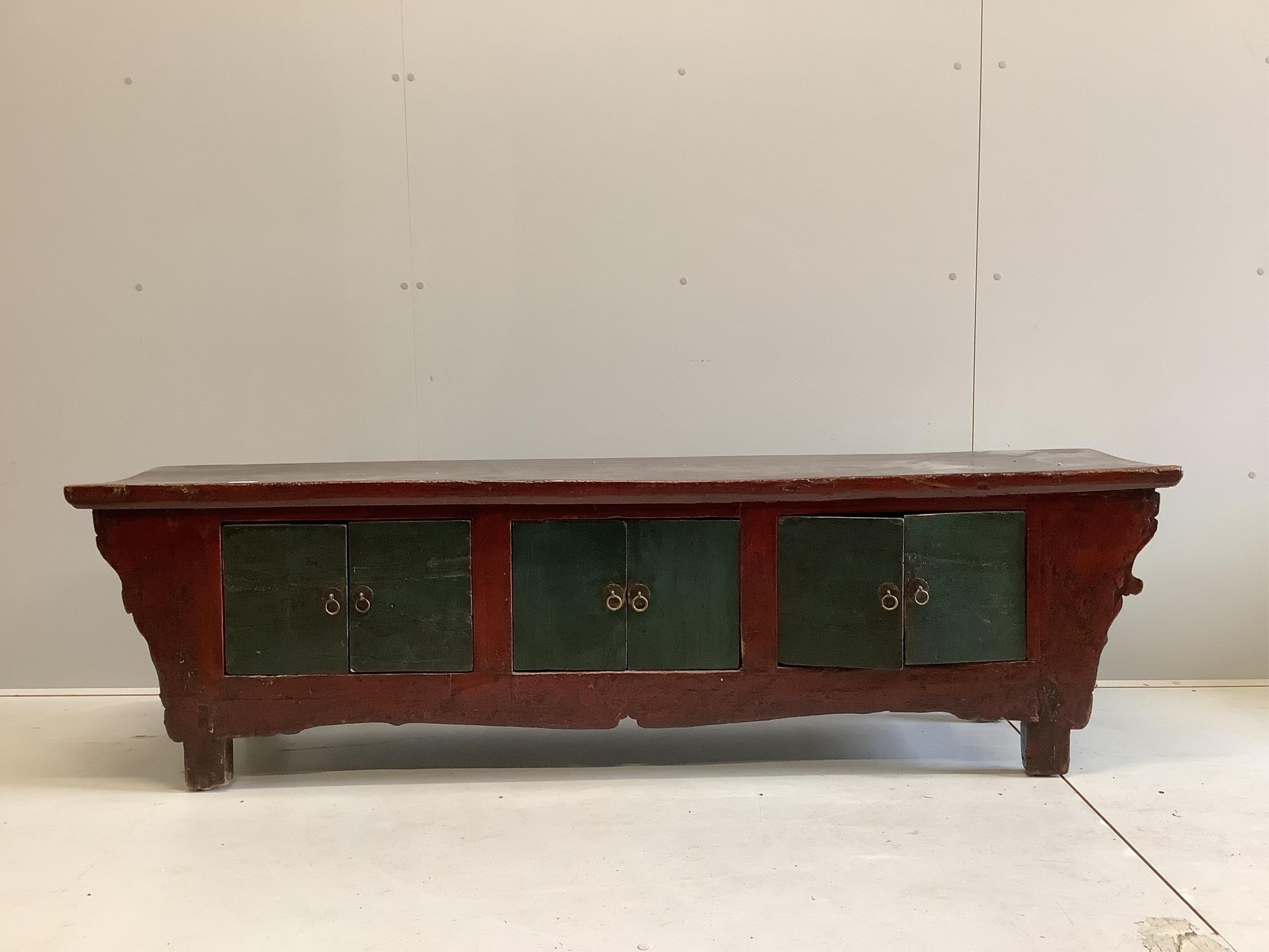 A Chinese painted low hardwood cabinet, width 185cm, depth 38cm, height 52cm. Condition - fair